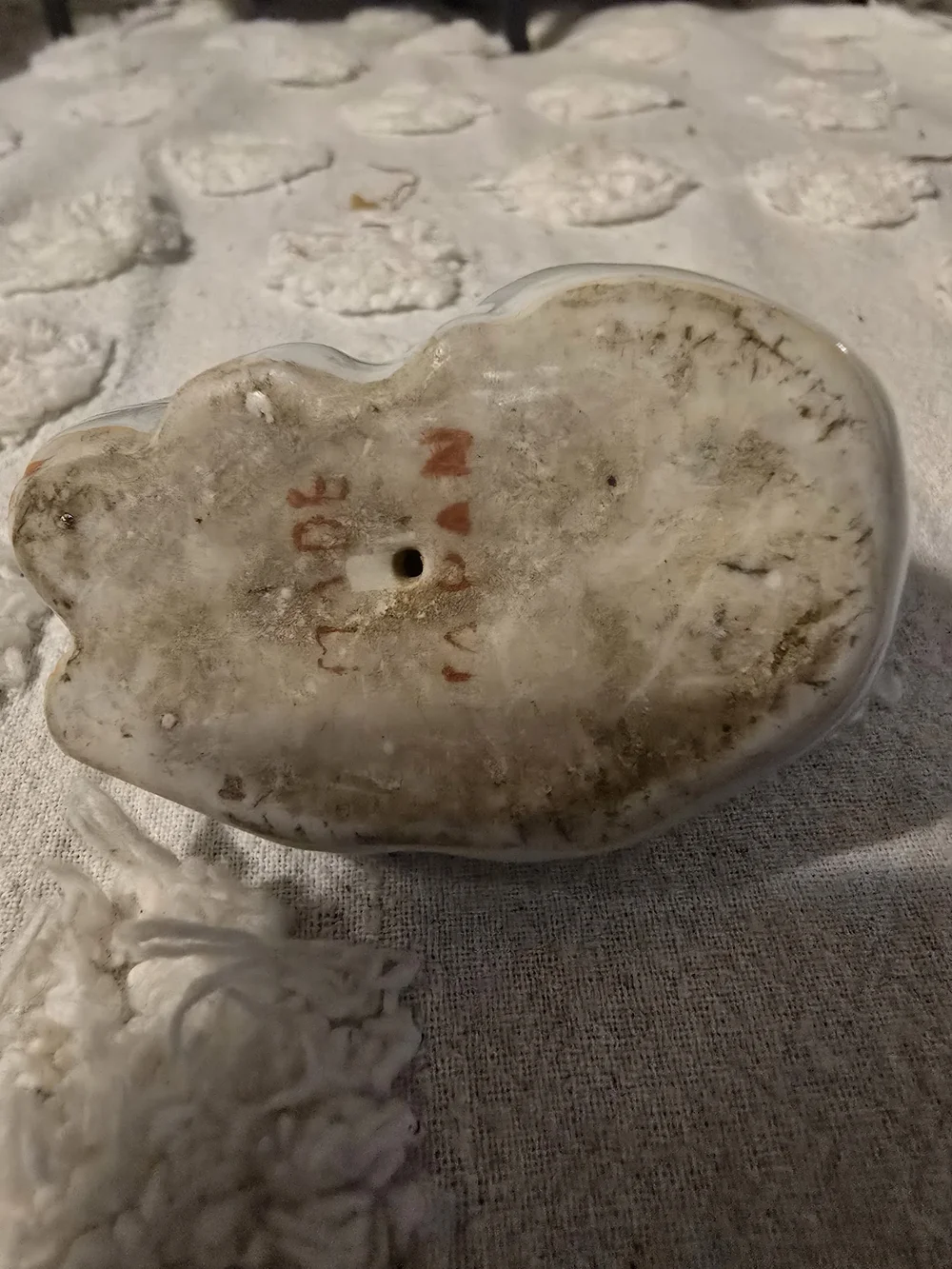 White Ceramic Sleeping Cat Figurine with Gold Accents and Orange Collar